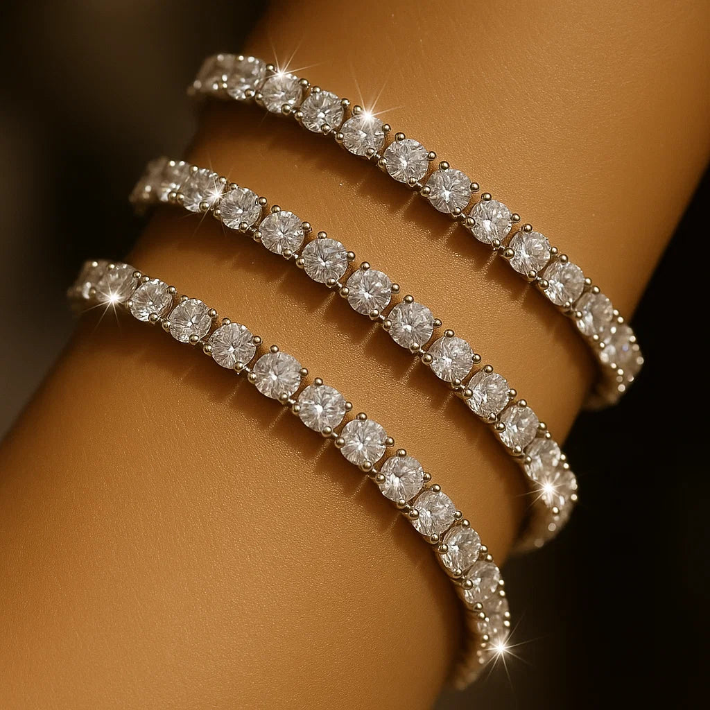 Alt text: “Female model stacking three TAHI Jewelry Inc tennis bracelets in white, rose, and yellow gold tones.”